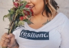 woman wearing a shirt with the body positive message - resilient
