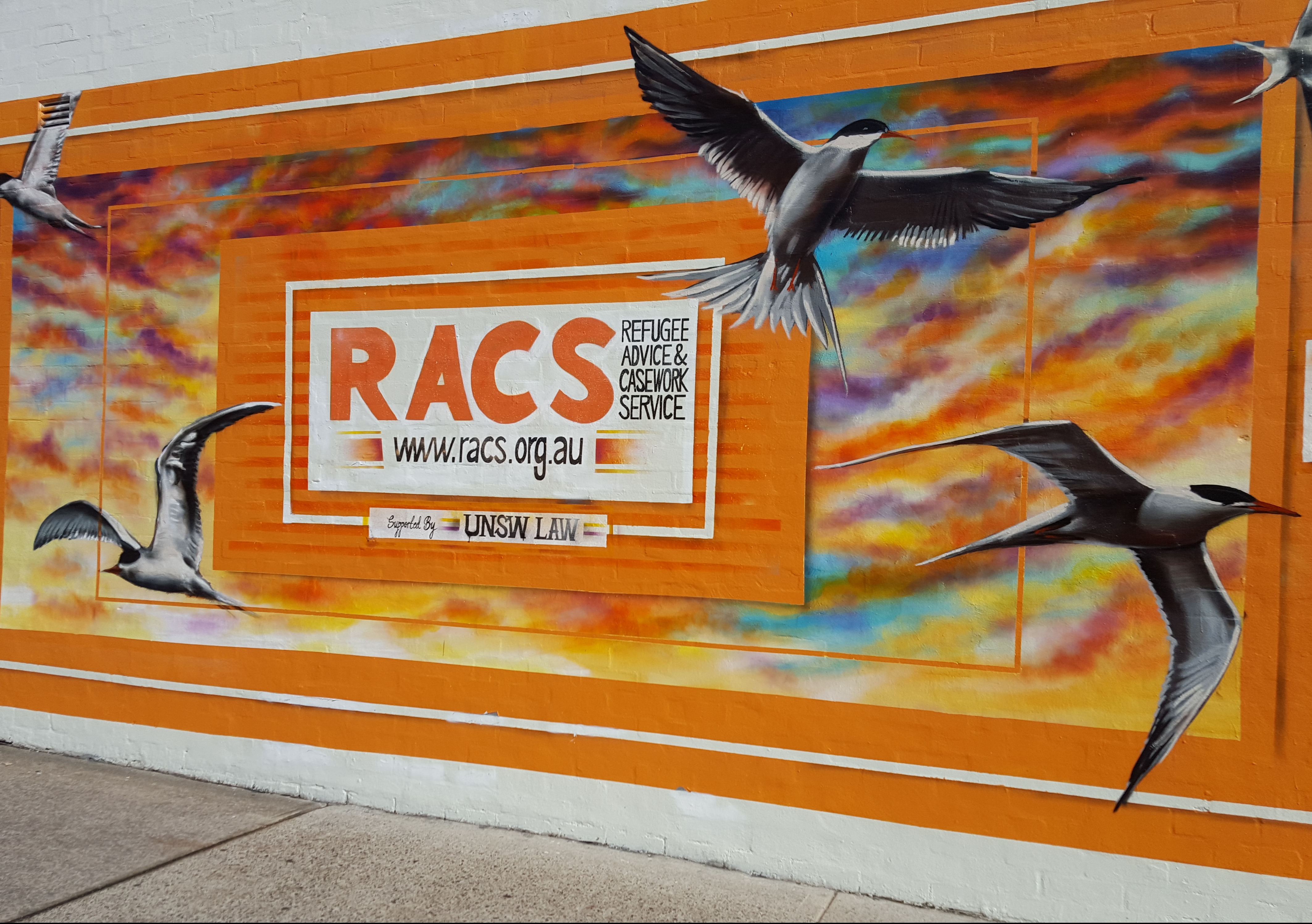 The new mural on the exterior of the Refugee Advice and Casework Service building.