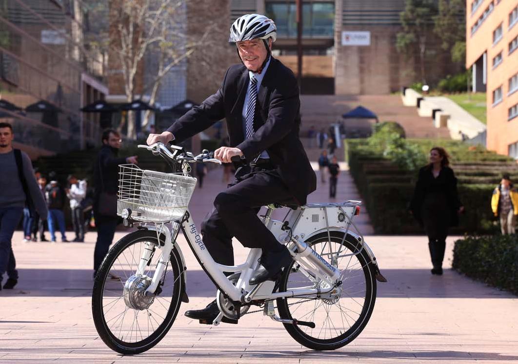 Dean of Engineering Professor Graham Davies rides the Hy-Cycle. (Photo: Grant Turner)