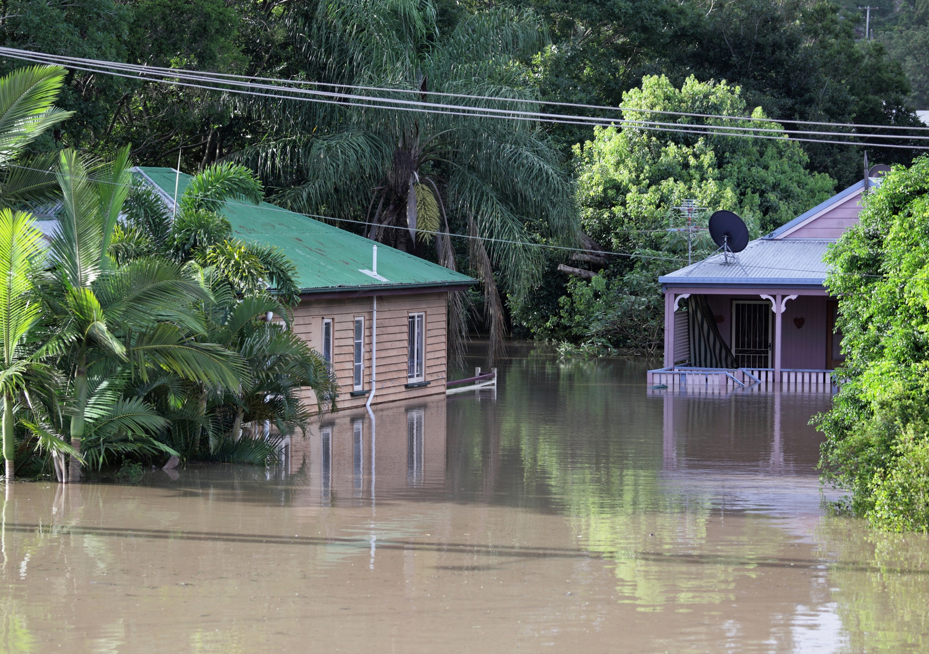 Two classic Queenslander style houses are flooded in Brisbane, Australia.