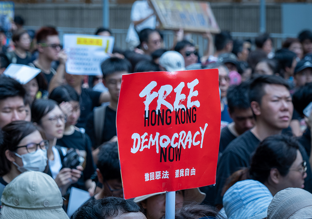 People gather in the streets of Hong Kong to protest against the controversial extradition bill in July 2020.  The bill was withdrawn but later became a part of the National Security Law when it was imposed on Hong Kong on June 30, 2020.  Image: Shutterstock