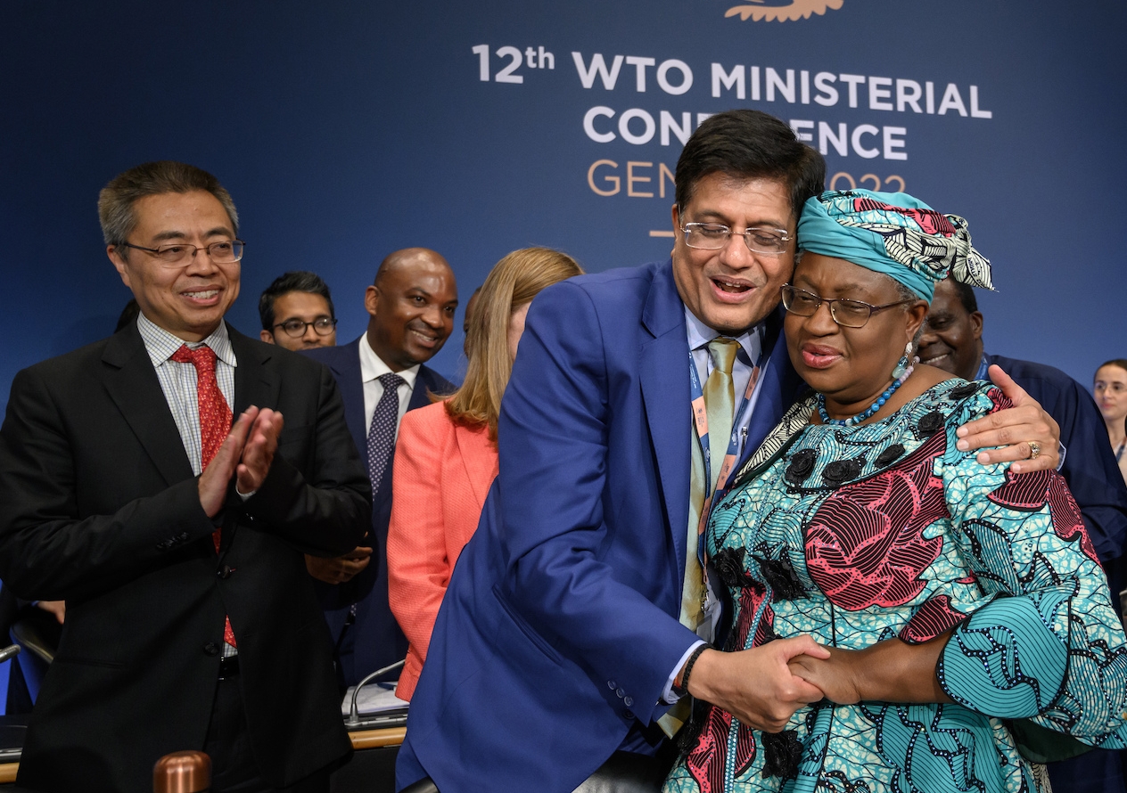 India’s minister of commerce Piyush Goyal and WTO director-general Ngozi Okonjo-Iweala celebrate the end of the WTO’s 12th Ministerial Conference. Photo: Fabrice Coffrini/Pool/Keystone via AP.